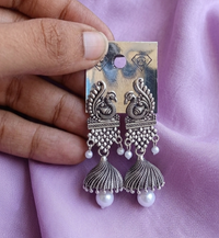 Peacock Motif Oxidized Silver Jhumkas with Pearl Drops